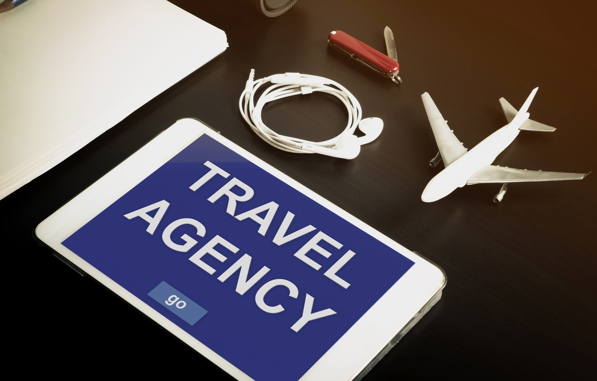 Online travel agency website on tablet screen.